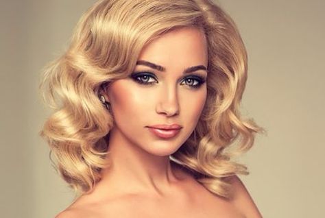 Girl with blonde hair and signature lashes.